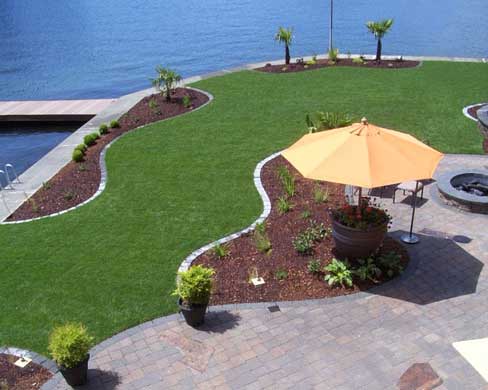 Beautiful lawn with a garden on waterfront